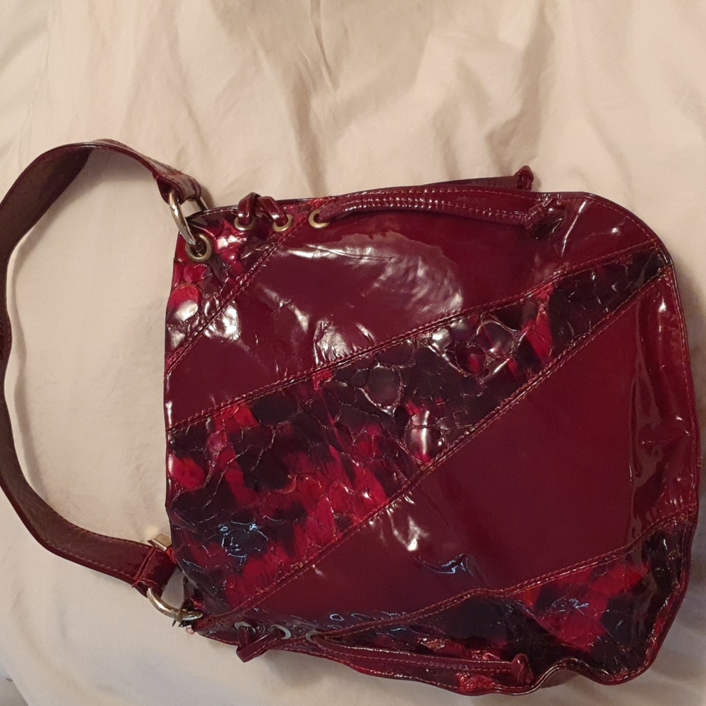 Patented burgundy purse